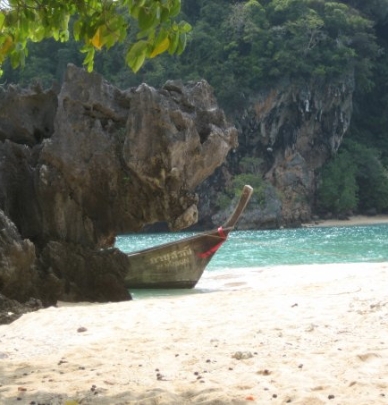 A boat sitting on a beach