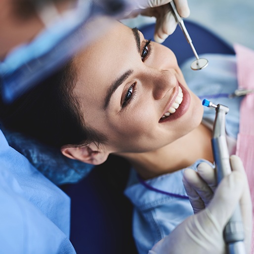 Woman receiving dental treatment