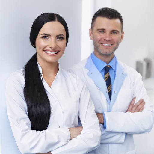 Two dental specialists smiling