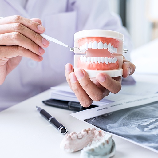 Dentist and patient reviewing dental treatment plan