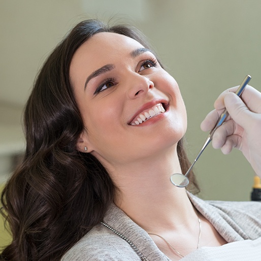 Dentist checking patient's smile