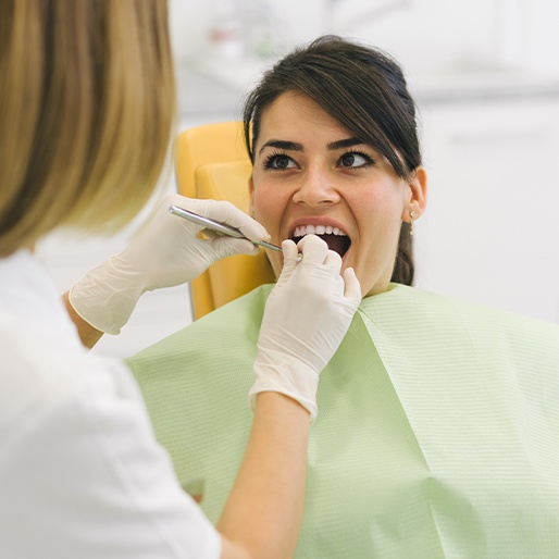 Woman receiving dental exam