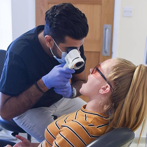 Patient receiving oral cancer screening