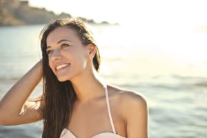 Smiling woman enjoying the ocean