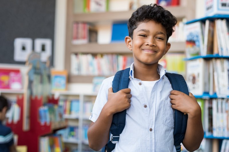 A smiling boy at school